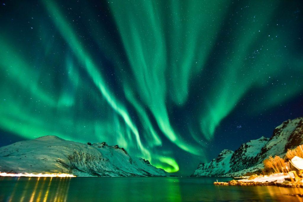 Lighting up Tromso, Norway. Source: https://www.muchbetteradventures.com/magazine/5-tips-for-seeing-the-northern-lights-in-the-norwegian-fjords/